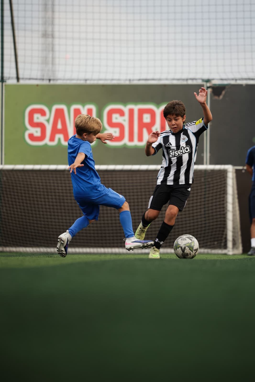 SG Sport players competing for the ball