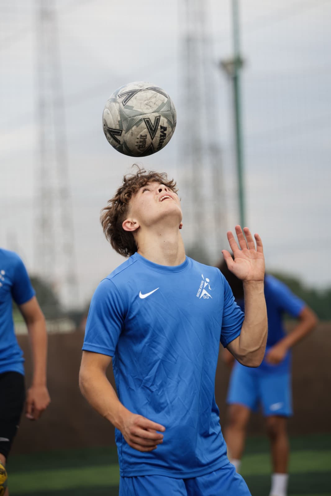SG Elite player heading the ball in training